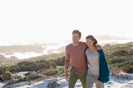 simsearch:6108-06905483,k - Happy couple walking on the beach Stock Photo - Premium Royalty-Free, Code: 6108-08663211