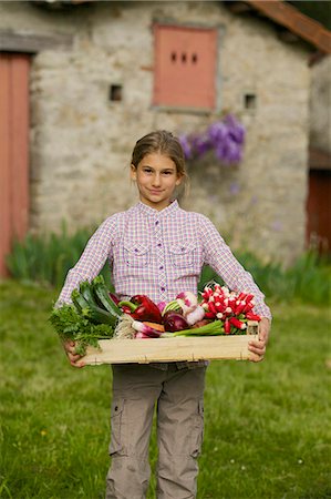 Young girl with vegetables from the garden Stock Photo - Premium Royalty-Free, Code: 6108-08636792