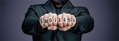 stock exchange - Businessman tattooed fists Stock Photo - Premium Royalty-Free, Code: 6108-08637358