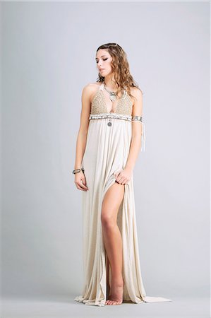fantasy - Young woman standing, front, wearing a beige dress "Sanhadja" Stock Photo - Premium Royalty-Free, Code: 6108-08637373