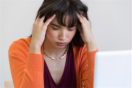 simsearch:6108-08725286,k - Close-up of a young woman suffering from a headache Stock Photo - Premium Royalty-Free, Code: 6108-08725339