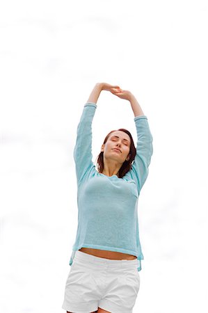 Pretty woman stretching in the park Foto de stock - Sin royalties Premium, Código: 6108-08909251