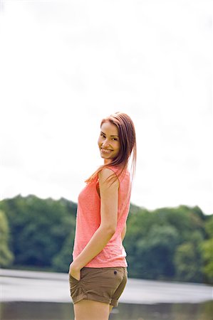 simsearch:6108-05859110,k - Woman smiling by a lake Stock Photo - Premium Royalty-Free, Code: 6108-08909254