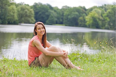 simsearch:6108-05859110,k - Woman relaxing by a lake Stock Photo - Premium Royalty-Free, Code: 6108-08909255