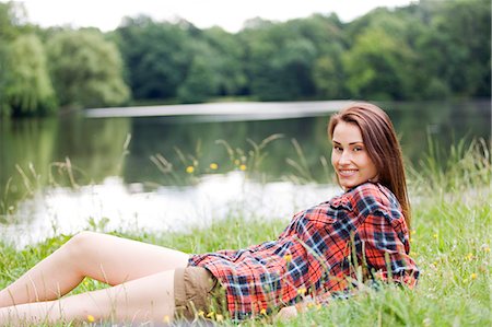 simsearch:6108-05859110,k - Woman relaxing by a lake Stock Photo - Premium Royalty-Free, Code: 6108-08909264