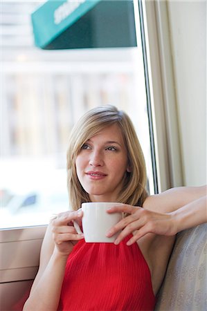 simsearch:6108-08909303,k - Portrait of a pretty blonde woman having a coffee indoors Stockbilder - Premium RF Lizenzfrei, Bildnummer: 6108-08909300