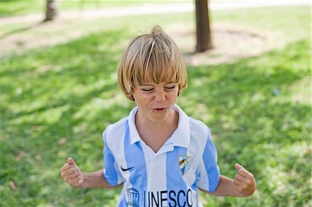 simsearch:877-06833417,k - Cute blond boy in park celebrating a goal Stock Photo - Premium Royalty-Free, Code: 6108-08909541