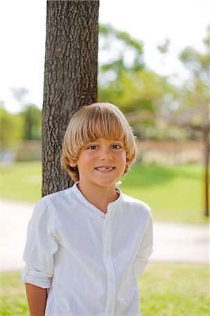 simsearch:877-06833417,k - Cute blonde boy in park Stock Photo - Premium Royalty-Free, Code: 6108-08909531