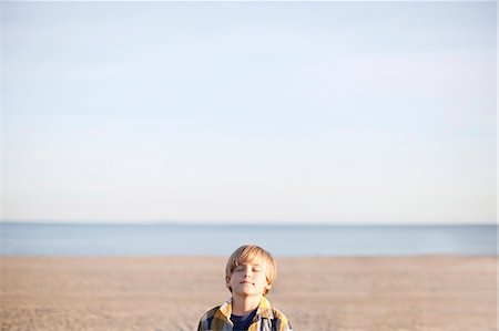 simsearch:877-08129127,k - Portrait of a young boy with eyes closed at the beach Stock Photo - Premium Royalty-Free, Code: 6108-08909827