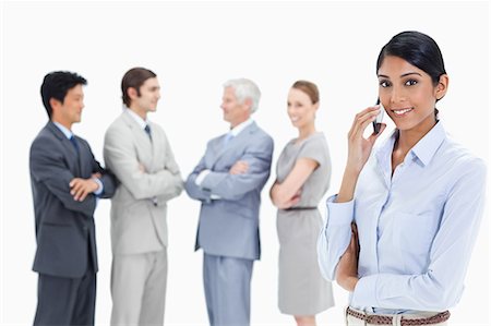 simsearch:6109-06002664,k - Close-up of a multicultural business team talking and a woman making a call in foreground Foto de stock - Sin royalties Premium, Código: 6109-06002650
