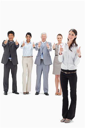 simsearch:6109-06002826,k - Smiling business team with their thumbs-up with a woman in foreground against white background Stock Photo - Premium Royalty-Free, Code: 6109-06002687