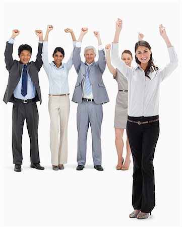 serrer - Équipe d'affaires souriant levant leurs bras avec une femme en premier plan sur fond blanc Photographie de stock - Premium Libres de Droits, Code: 6109-06002688