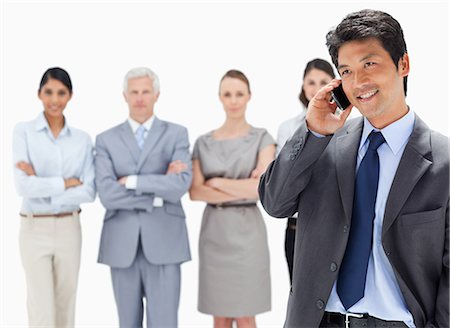 simsearch:6109-06002664,k - Close-up of a serious business team with an Asian man making a call in foreground Foto de stock - Sin royalties Premium, Código: 6109-06002697