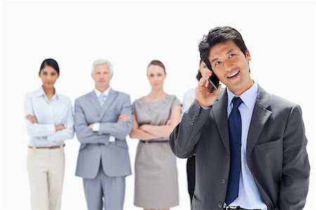 simsearch:6109-06002664,k - Close-up of business team with a smiling Asian man making a call in foreground Foto de stock - Sin royalties Premium, Código: 6109-06002696