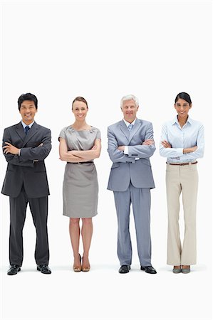 simsearch:6109-06002847,k - Smiling multicultural business team with their arms folded against white backgorund Foto de stock - Royalty Free Premium, Número: 6109-06002616