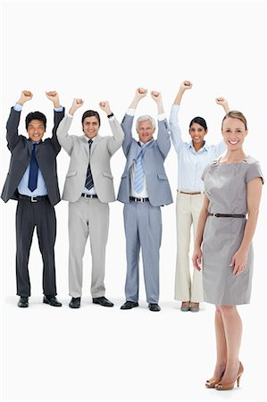 serrer - Équipe des affaires multiculturelles, levant les bras avec une femme souriante en avant-plan sur fond blanc Photographie de stock - Premium Libres de Droits, Code: 6109-06002633