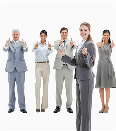 puño cerrado - Blonde woman with business people approving behind her against white background Foto de stock - Sin royalties Premium, Código: 6109-06002798