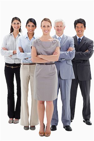 simsearch:6109-06002664,k - Smiling business team with their arms folded against white background Foto de stock - Sin royalties Premium, Código: 6109-06002728