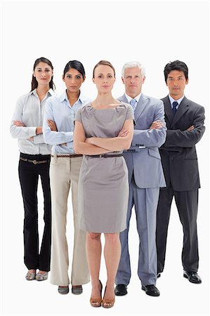 simsearch:6109-06002664,k - Close-up of a serious business team with their arms folded against white background Foto de stock - Sin royalties Premium, Código: 6109-06002729