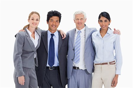 simsearch:6109-06002735,k - Smiling business team arm in arm against white background Stock Photo - Premium Royalty-Free, Code: 6109-06002848
