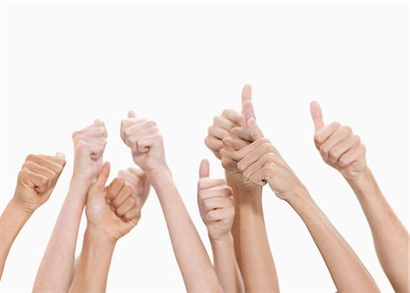 friendship hand - Thumbs up and hands raised against white background Stock Photo - Premium Royalty-Free, Code: 6109-06002868