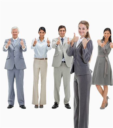 simsearch:6109-06002781,k - Happy blonde woman with business people approving behind her against white background Foto de stock - Sin royalties Premium, Código: 6109-06002800