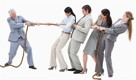 single file - Boss pulling a rope against his employees with white background Foto de stock - Sin royalties Premium, Código: 6109-06002807