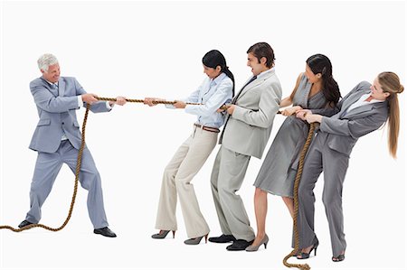 Business people pulling a rope against their boss with white background Stock Photo - Premium Royalty-Free, Code: 6109-06002806