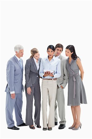 Speechless business people watching a touchpad against white background Foto de stock - Sin royalties Premium, Código: 6109-06002825