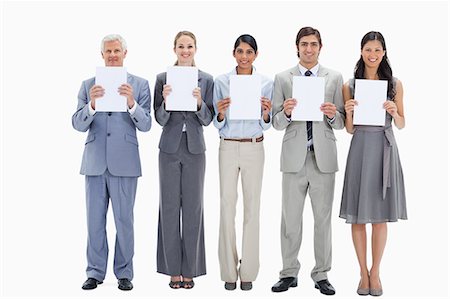 simsearch:6109-06002827,k - Business team holding five white placards against white background Stock Photo - Premium Royalty-Free, Code: 6109-06002828