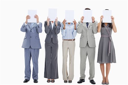 ethnic holding sign - Five business people hiding their faces behind small white placards against white background Stock Photo - Premium Royalty-Free, Code: 6109-06002829