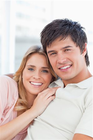 simsearch:6109-06003128,k - A close up shot of an embraced man and woman looking in front of them. Stock Photo - Premium Royalty-Free, Code: 6109-06003102