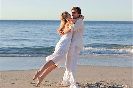 ruotare - Young couple on the beach spinning Stock Photo - Premium Royalty-Free, Code: 6109-06003824