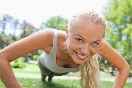 foreshortening - Young sportswoman doing push ups Stock Photo - Premium Royalty-Free, Code: 6109-06004303