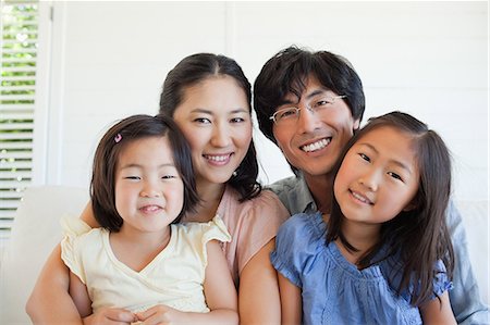 photos of asian families - The entire family grouped together for a photo Stock Photo - Premium Royalty-Free, Code: 6109-06004875