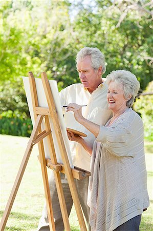 painter (artwork) - Man and a woman painting in a park Foto de stock - Sin royalties Premium, Código: 6109-06004808