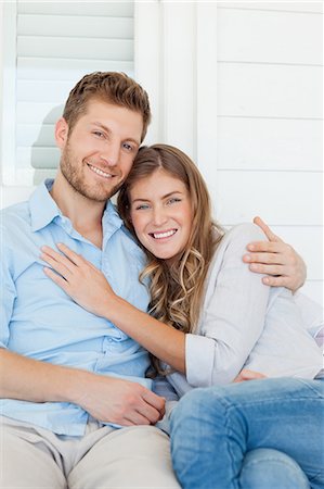 A close up shot of a woman and a man holding one another while they smile Stock Photo - Premium Royalty-Free, Code: 6109-06005180