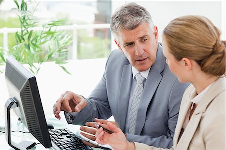 simsearch:6109-06005291,k - Businessman giving instruction to his secretary in an office Stock Photo - Premium Royalty-Free, Code: 6109-06005251