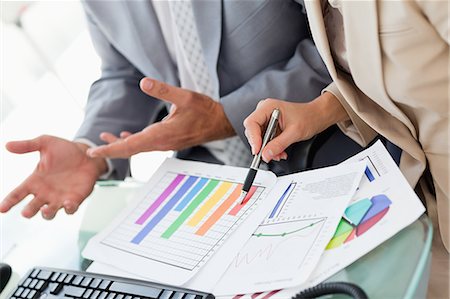 diagrams in office - Business people working on statistics in an office Stock Photo - Premium Royalty-Free, Code: 6109-06005262