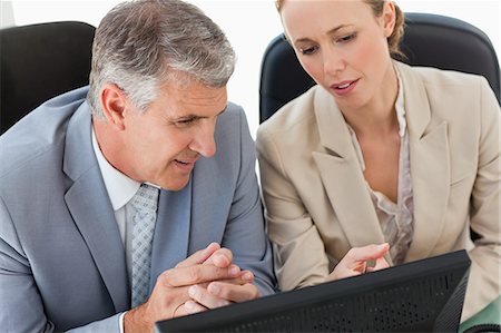 simsearch:6109-06005291,k - People in a suit with a computer in a office Stock Photo - Premium Royalty-Free, Code: 6109-06005272