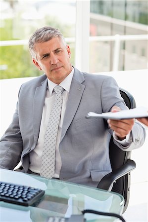 simsearch:6109-06005455,k - Businessman giving files in a bright office Fotografie stock - Premium Royalty-Free, Codice: 6109-06005338