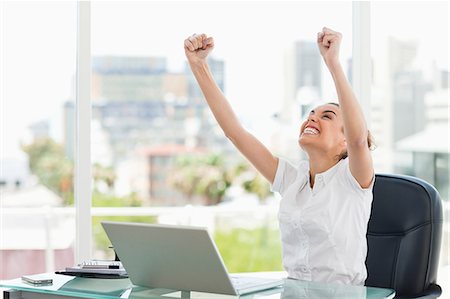 female computer laughing - Tanned businesswoman got a promotion in a bright office Stock Photo - Premium Royalty-Free, Code: 6109-06005409