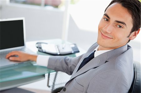 Portrait of a man in a suit in a bright office Stock Photo - Premium Royalty-Free, Code: 6109-06005557