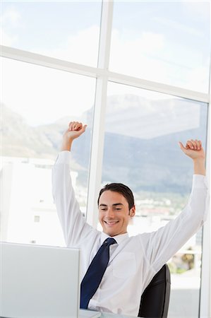 formal man sitting - Businessman receiving a good news with view on mountain in background Stock Photo - Premium Royalty-Free, Code: 6109-06005576