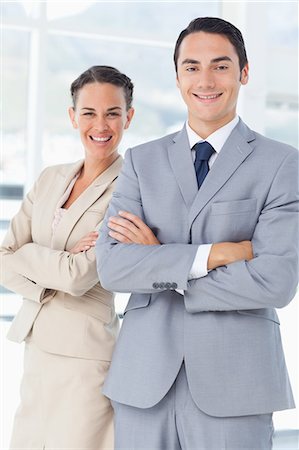 sales man in business suit - Smiling businesspeople with their arms crossed Stock Photo - Premium Royalty-Free, Code: 6109-06005655