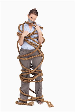 stress employees - Entangled businesswoman against a white background Stock Photo - Premium Royalty-Free, Code: 6109-06005677