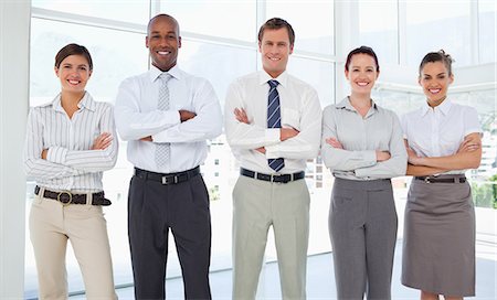 salesman - Smiling businessteam with their arms folded Stock Photo - Premium Royalty-Free, Code: 6109-06005756