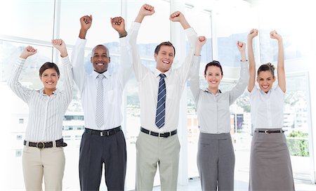 female cross arms confident smile - Cheering young businessteam Stock Photo - Premium Royalty-Free, Code: 6109-06005758