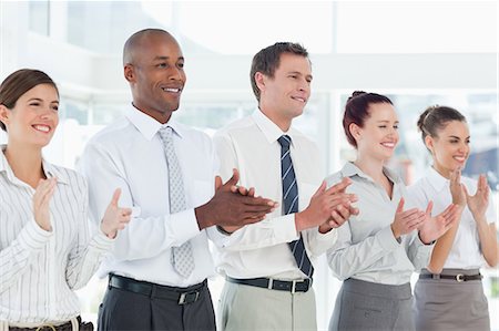 simsearch:6109-06005762,k - Applauding young salesteam standing in a line Stock Photo - Premium Royalty-Free, Code: 6109-06005760