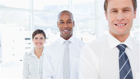 formal black man - Smiling young salespeople standing in a row Stock Photo - Premium Royalty-Free, Code: 6109-06005771